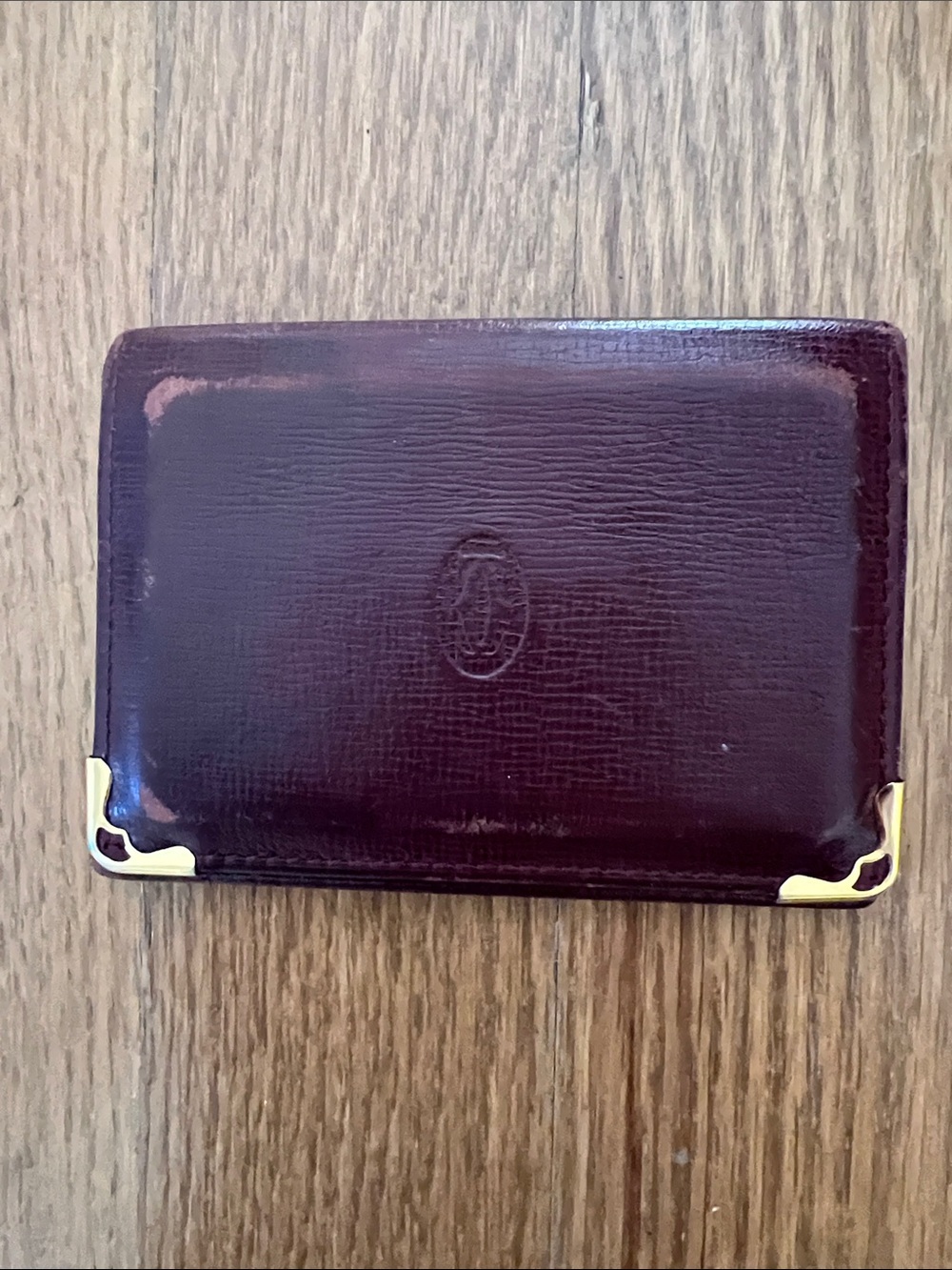 Cartier Burgundy Leather Card Case with Gold Corner Accents